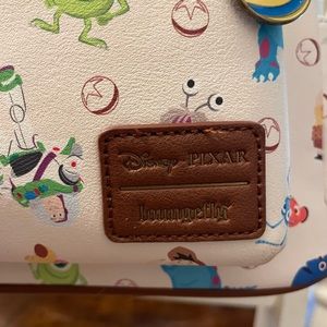 Loungefly pixstar characters bookbag